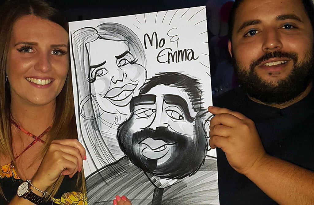 wedding caricaturist booked in Crawley Arora Hotel Mo and Emma are pleased with their cartoon