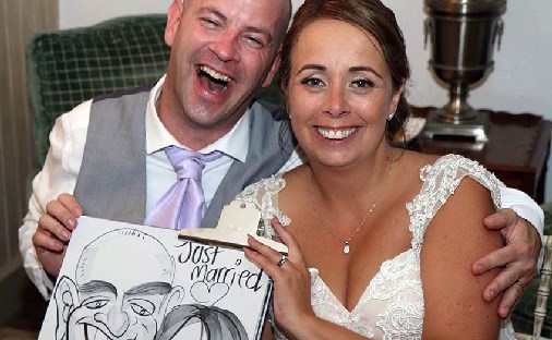 Bride and Groom enjoy sitting down for a caricature