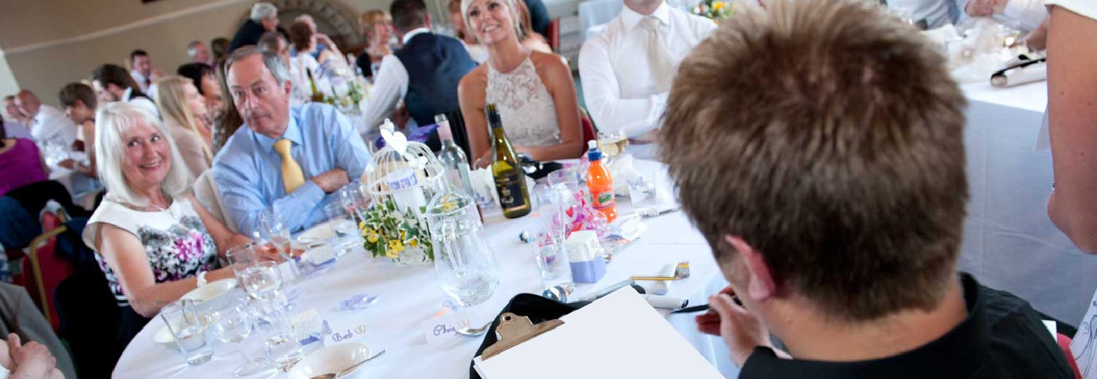 Caricaturist drawing around the tables at a Berkshire Wedding