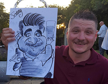 sonny the teacher posing with caricature