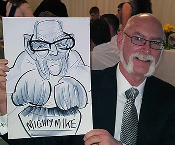Mighty Mike showing the camera his caricature