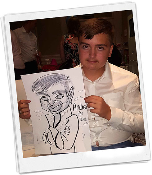Andrew the Great is photoed with his caricature at a freshers event
