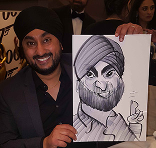 photo of a man holding his caricature at a film premier
