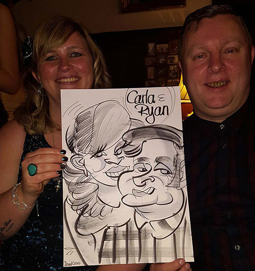 Carla and Ryan show off their caricature