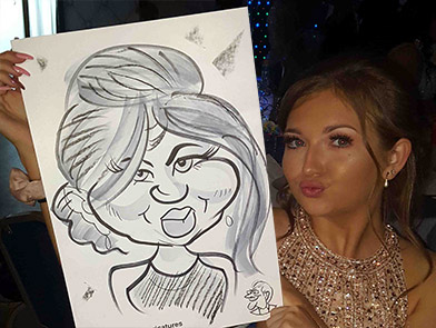 selfie pose with her caricature at school prom