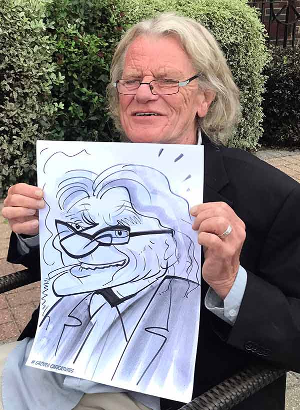 Man from Beaconsfield poses with his caricature