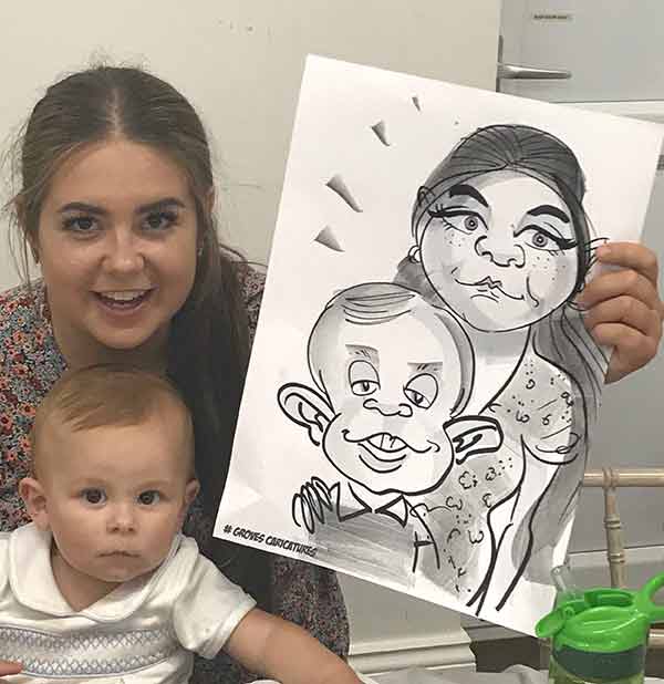 cute baby and sister pose with their caricature