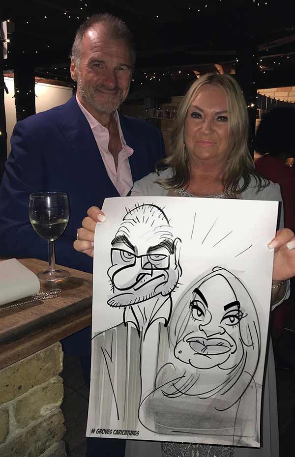 wedding guests at cooling barn get a caricature portrait