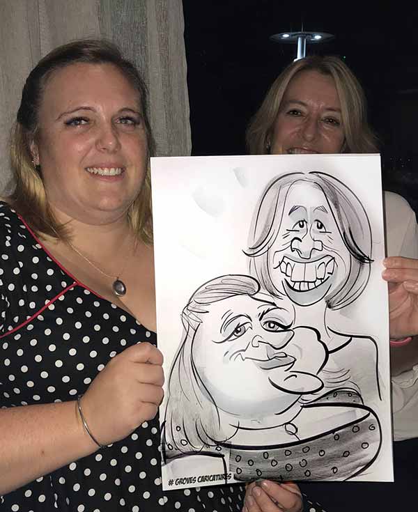 New Forest girls holds their caricature