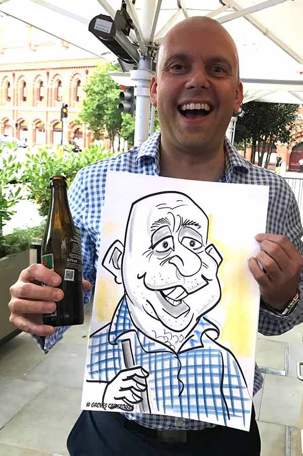 Man from Beaconsfield poses with his caricature