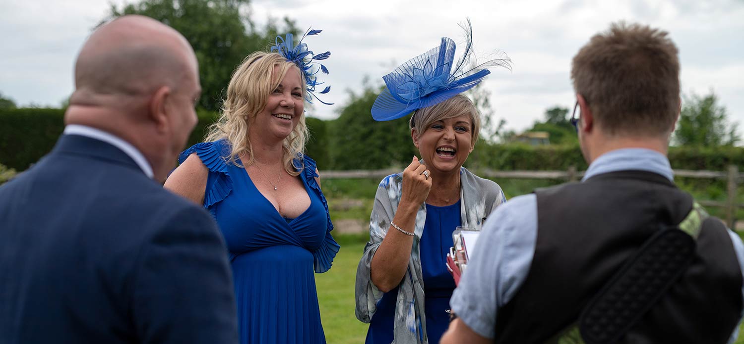 full on laughing wedding guests