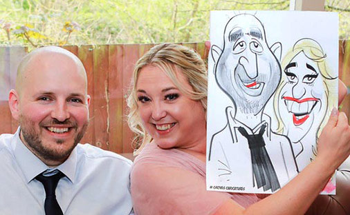 couple at the burfold hotel with a cartoon drawing couple at the burfold hotel with there caricature